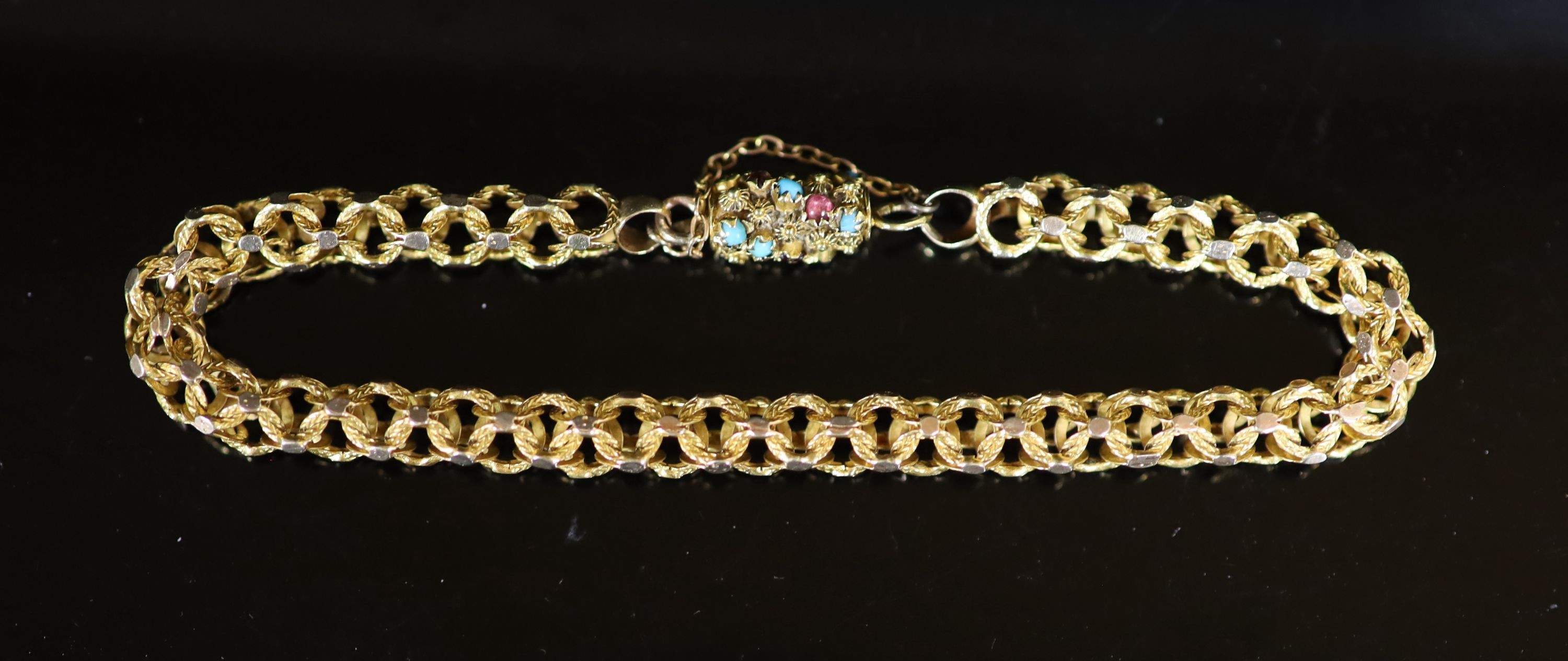 A 19th century gold triple ring link bracelet, with cabochon turquoise and garnet set barrel shaped clasp